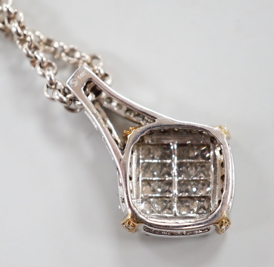 A modern 14k yellow and white metal, pave set diamond pendant, 23mm, on a Chinese? white metal chain, 34cm.